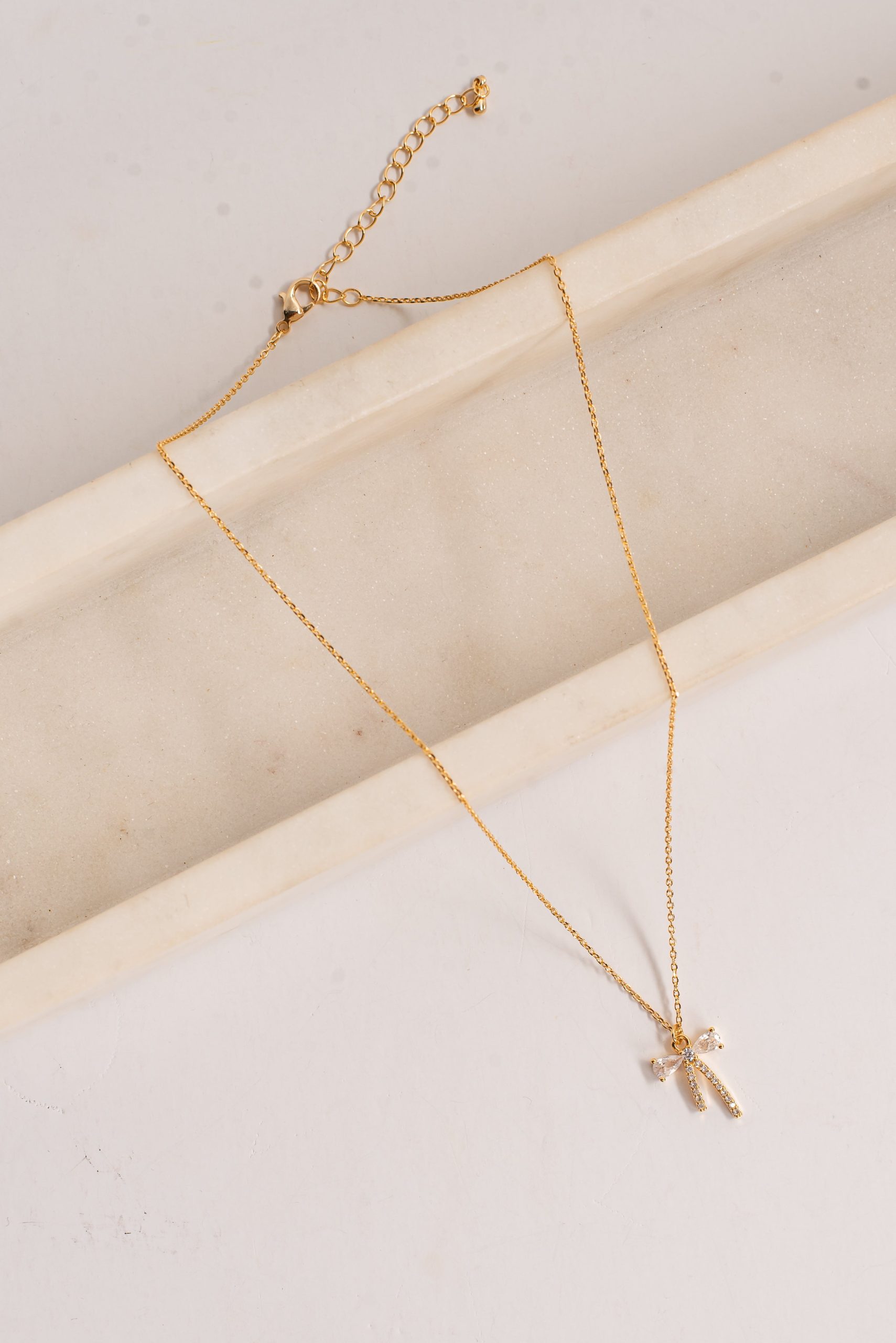 Charlie Gold Rhinestone Bow Charm Necklace - Image 2