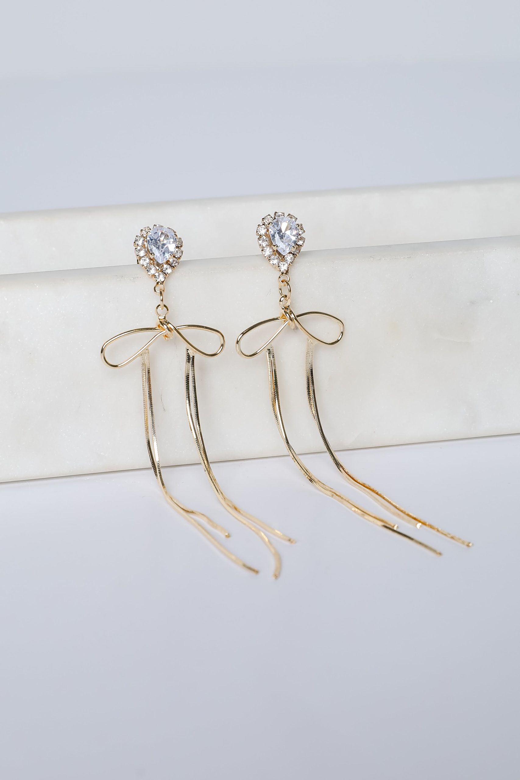 Lily Gold Rhinestone Bow Chain Drop Earrings - Image 3