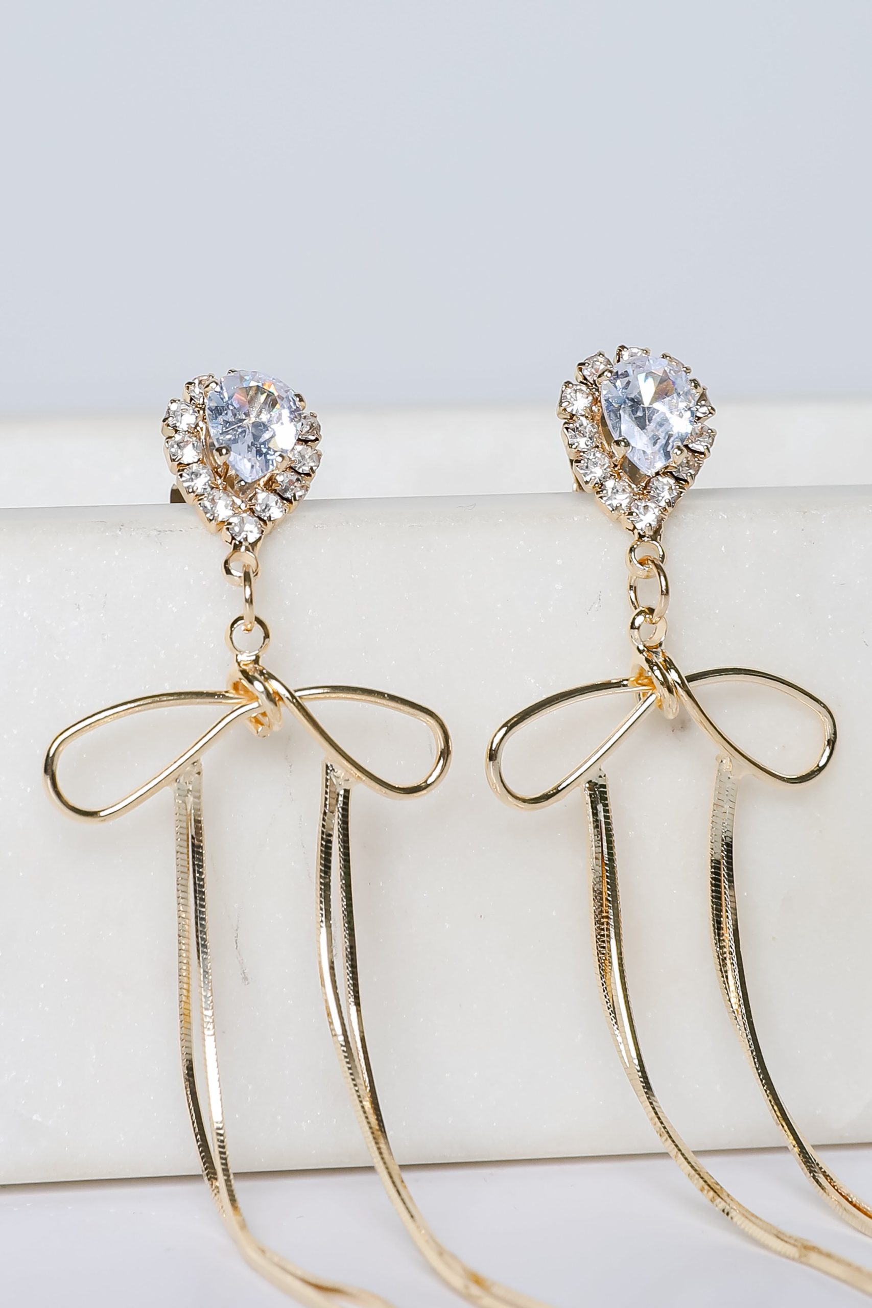 Lily Gold Rhinestone Bow Chain Drop Earrings - Image 2